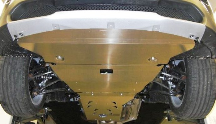 A close-up of the composite crankcase guard. The multi-layer structure and stiffening ribs are visible.