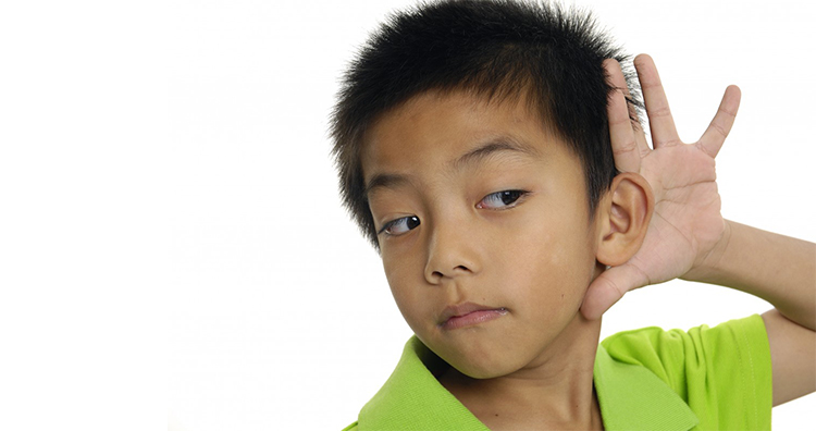 The child is trying to hear Child trying to hear